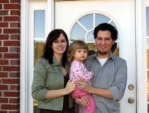 homeowner couple with baby